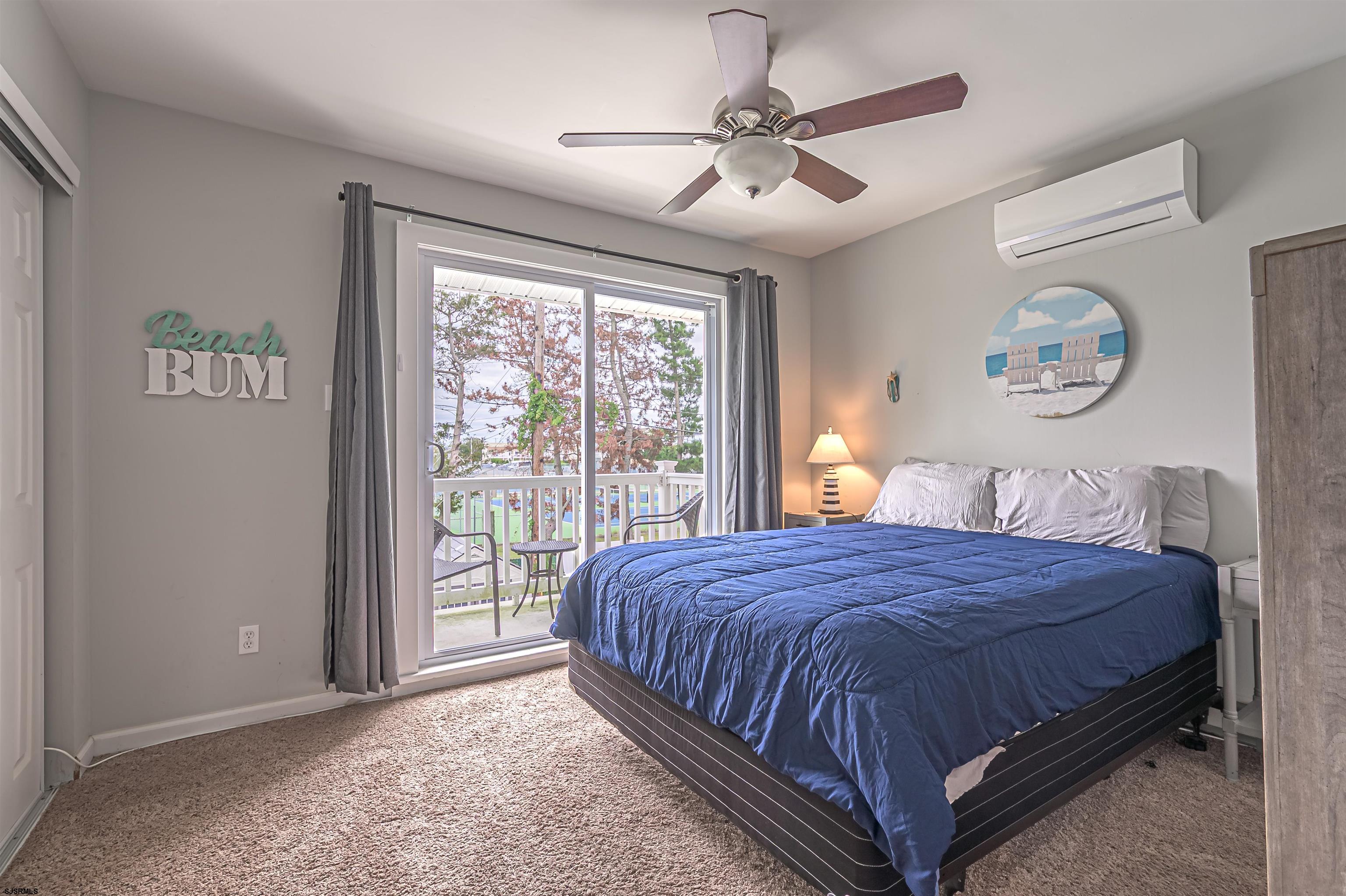 138 44th Street South, Unit D Brigantine, NJ 08203 - Photo 12 of 25 a bedroom with a large bed and a window