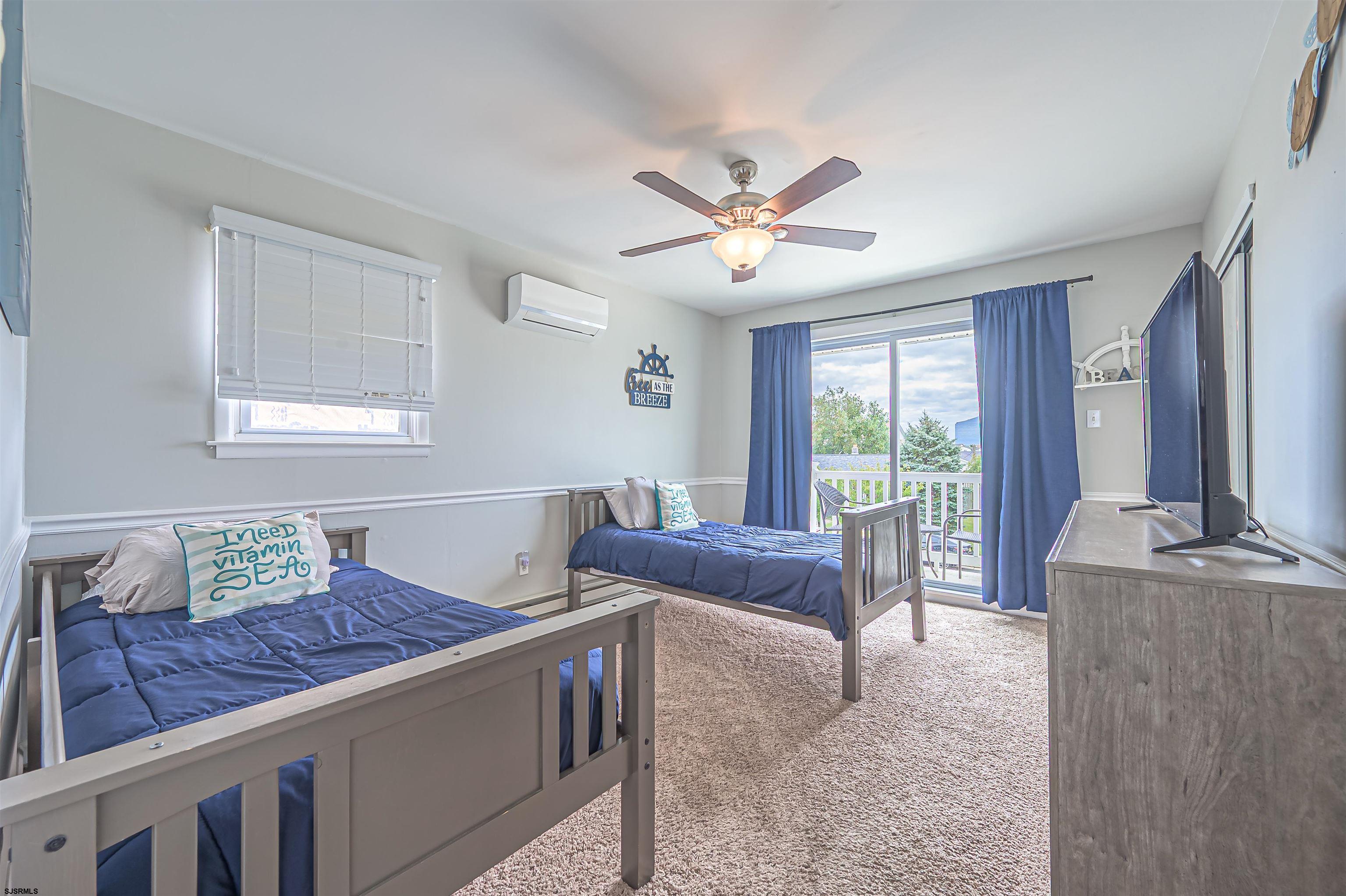 138 44th Street South, Unit D Brigantine, NJ 08203 - Photo 15 of 25 a living room with furniture and a floor to ceiling window
