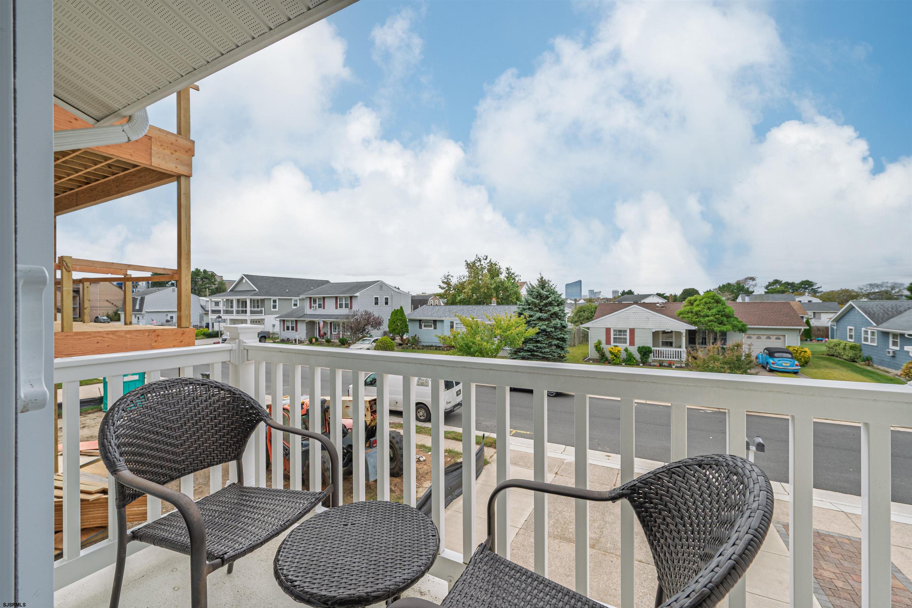 138 44th Street South, Unit D Brigantine, NJ 08203 - Photo 16 of 25 a view of a chairs and table on the roof deck