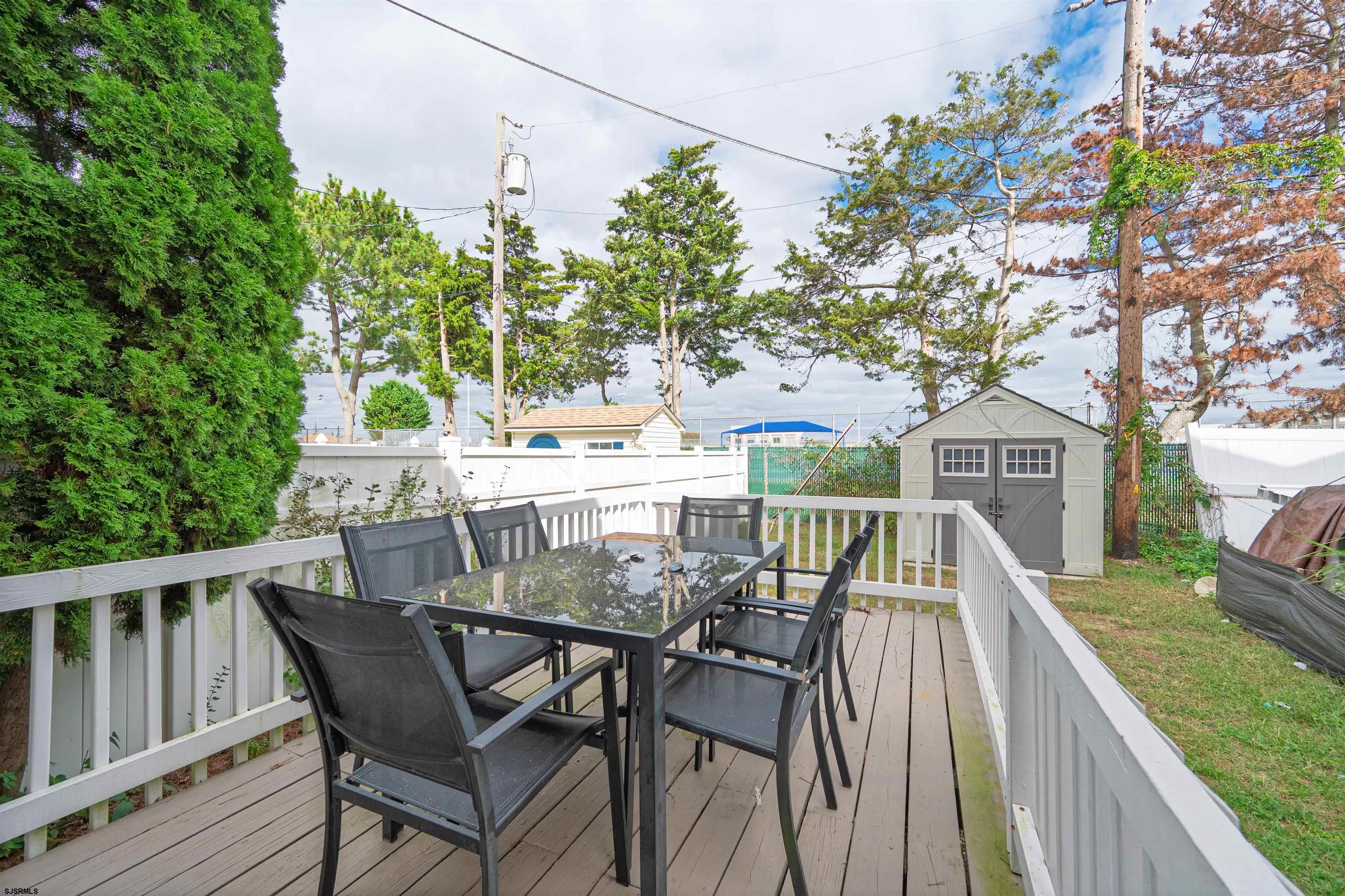 138 44th Street South, Unit D Brigantine, NJ 08203 - Photo 19 of 25 a view of a two chairs and table in the balcony