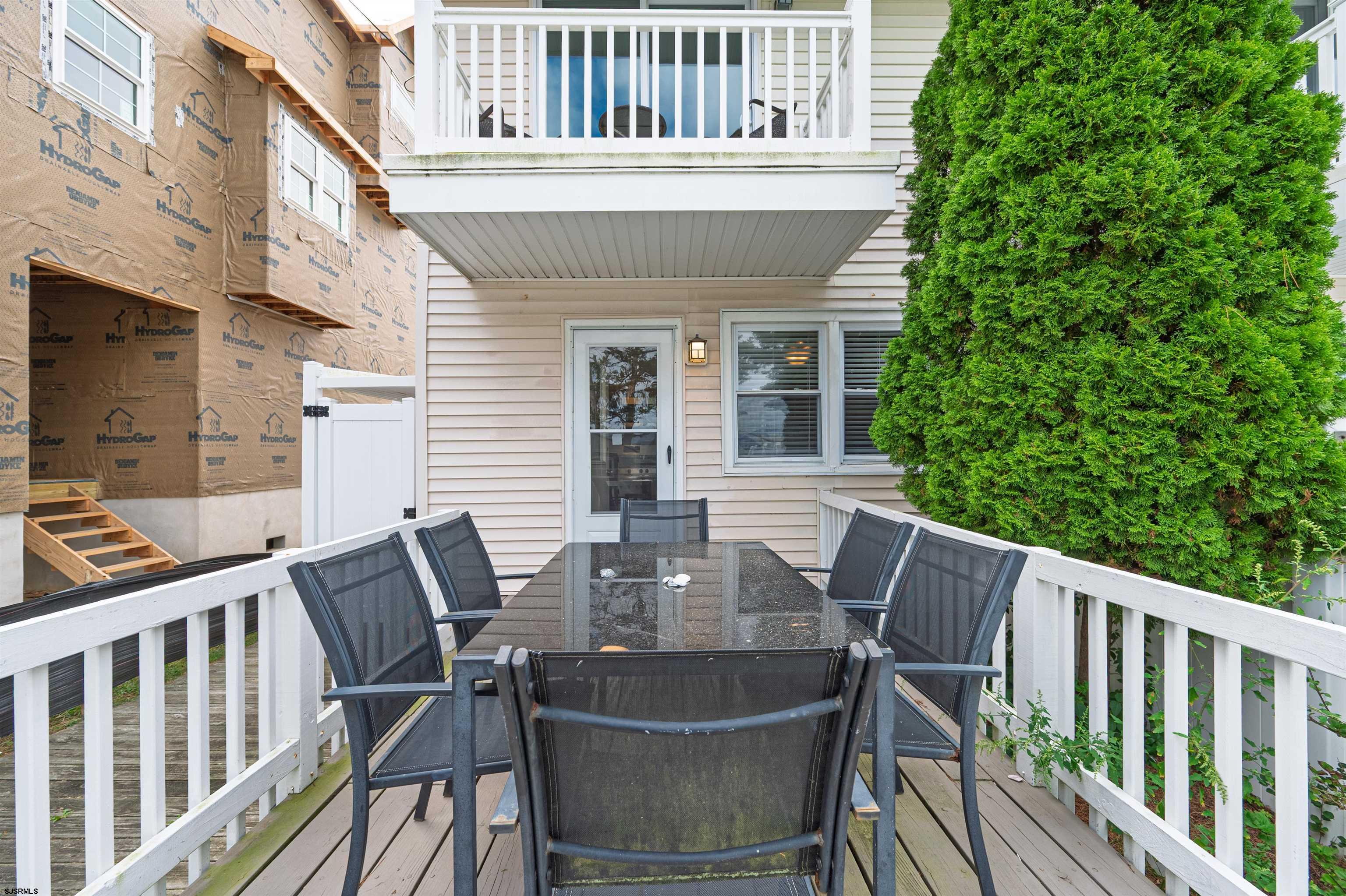 138 44th Street South, Unit D Brigantine, NJ 08203 - Photo 20 of 25 a view of a chair and table in the balcony