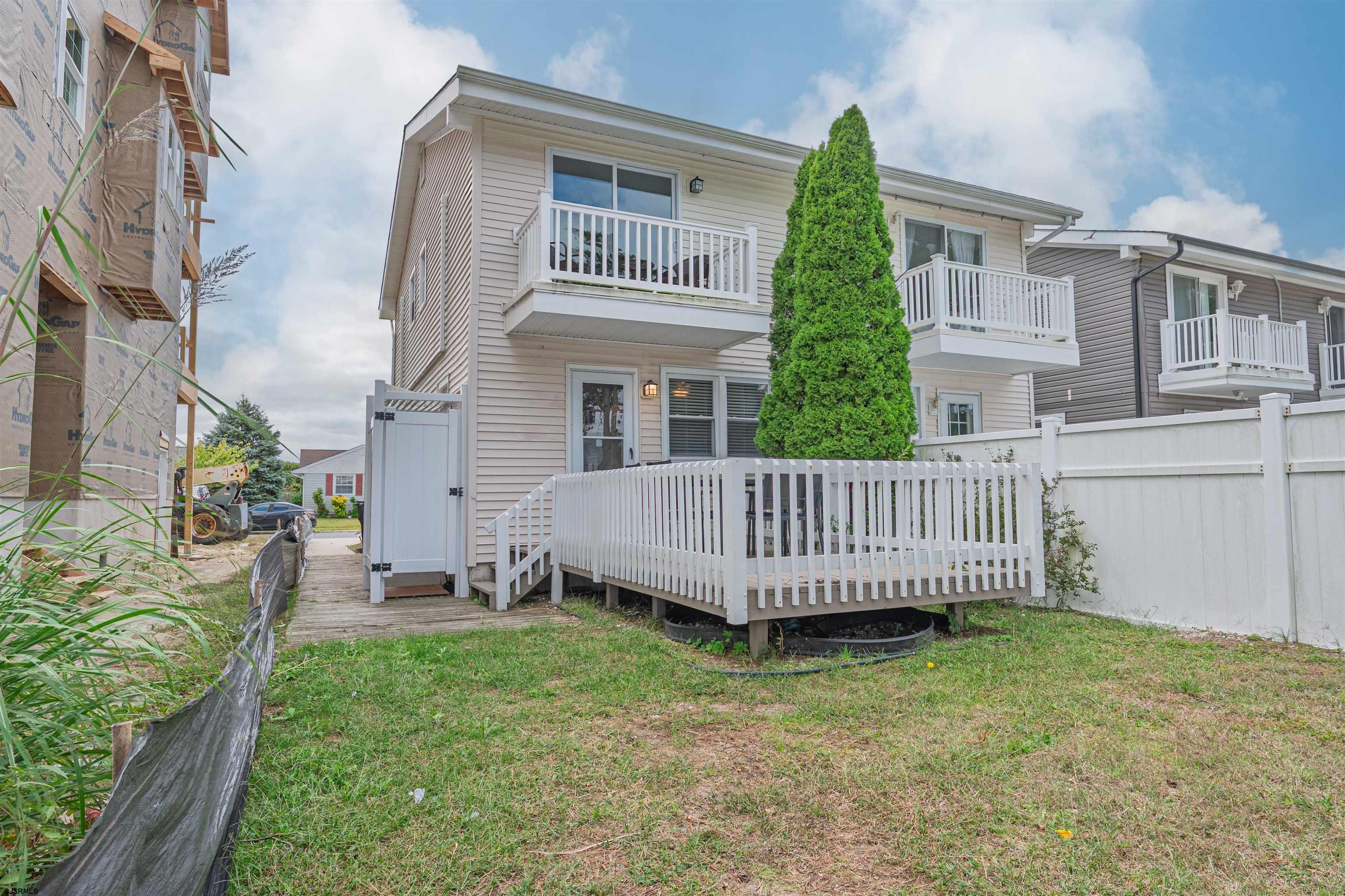 138 44th Street South, Unit D Brigantine, NJ 08203 - Photo 23 of 25 a view of a house with a yard and deck
