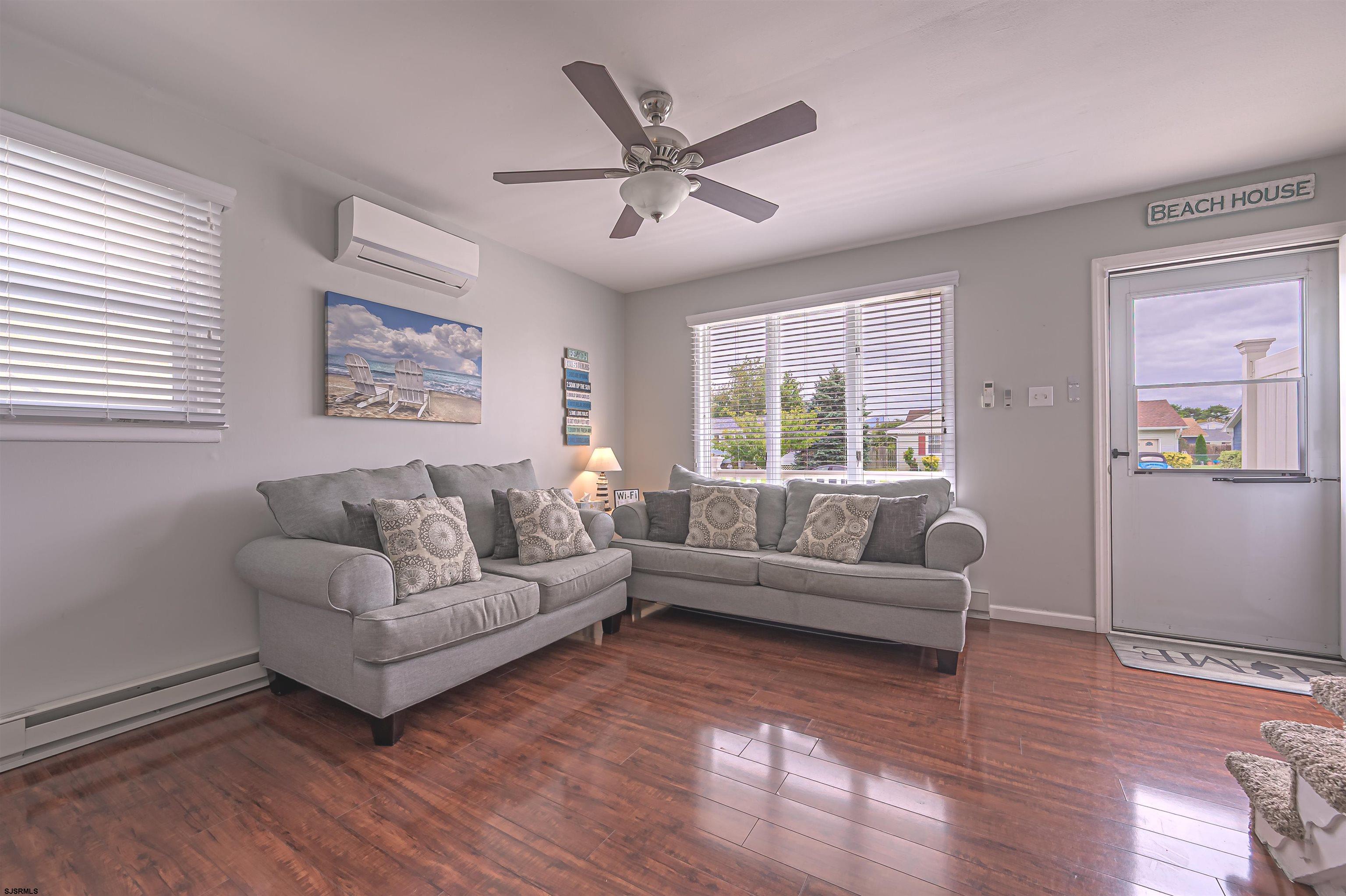 138 44th Street South, Unit D Brigantine, NJ 08203 - Photo 4 of 25 a living room with furniture and a large window
