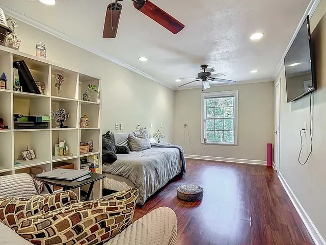 a bed room with two beds and a flat screen tv