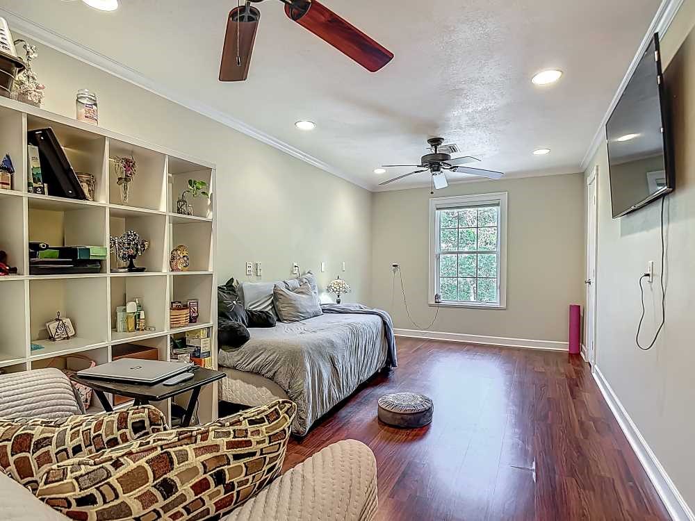 7330 36th Court Vero Beach, FL 32967 - Photo 11 of 33 a bed room with two beds and a flat screen tv