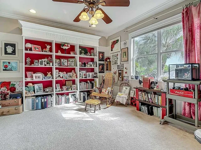 a room with furniture and a large window