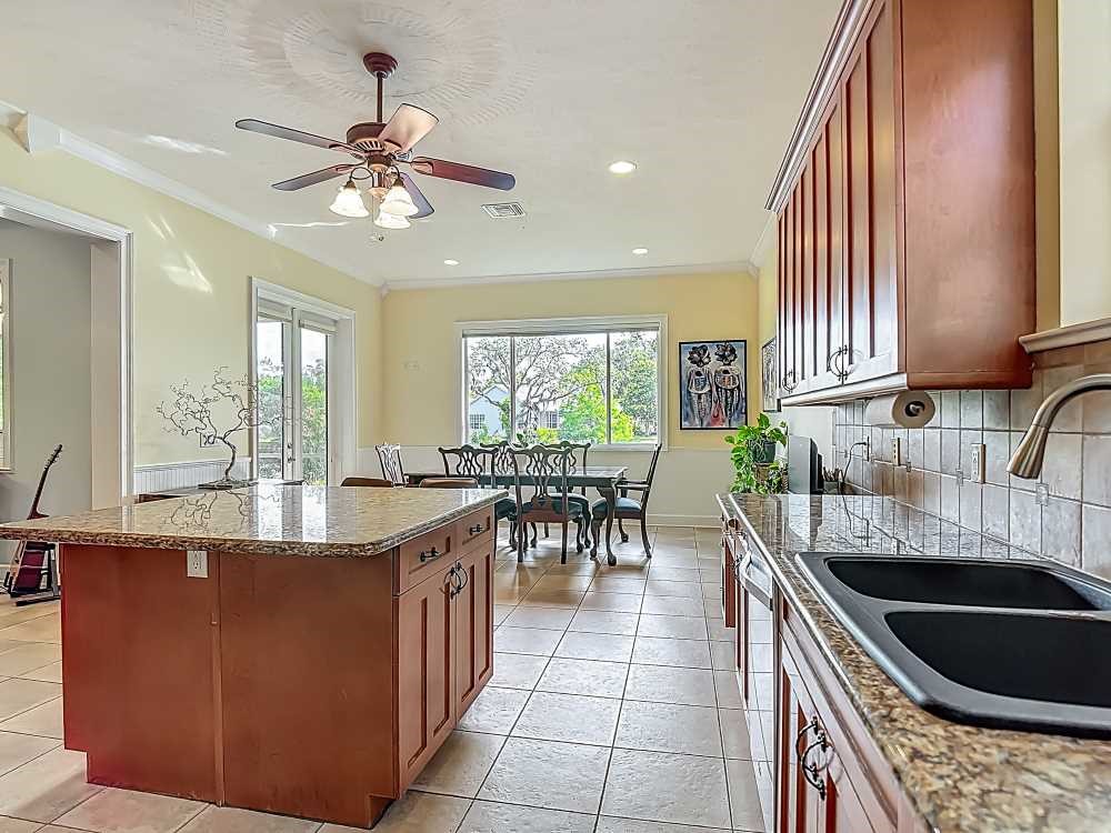7330 36th Court Vero Beach, FL 32967 - Photo 13 of 33 a kitchen with granite countertop lots of counter top space