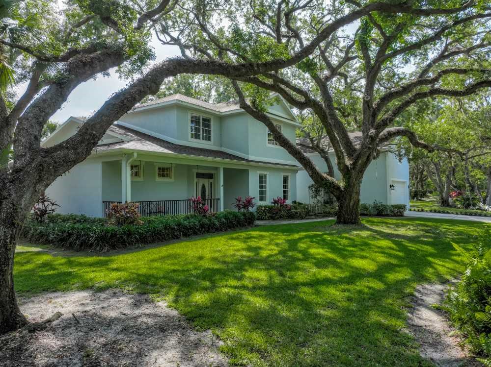 7330 36th Court Vero Beach, FL 32967 - Photo 22 of 33 a front view of house with yard and green space