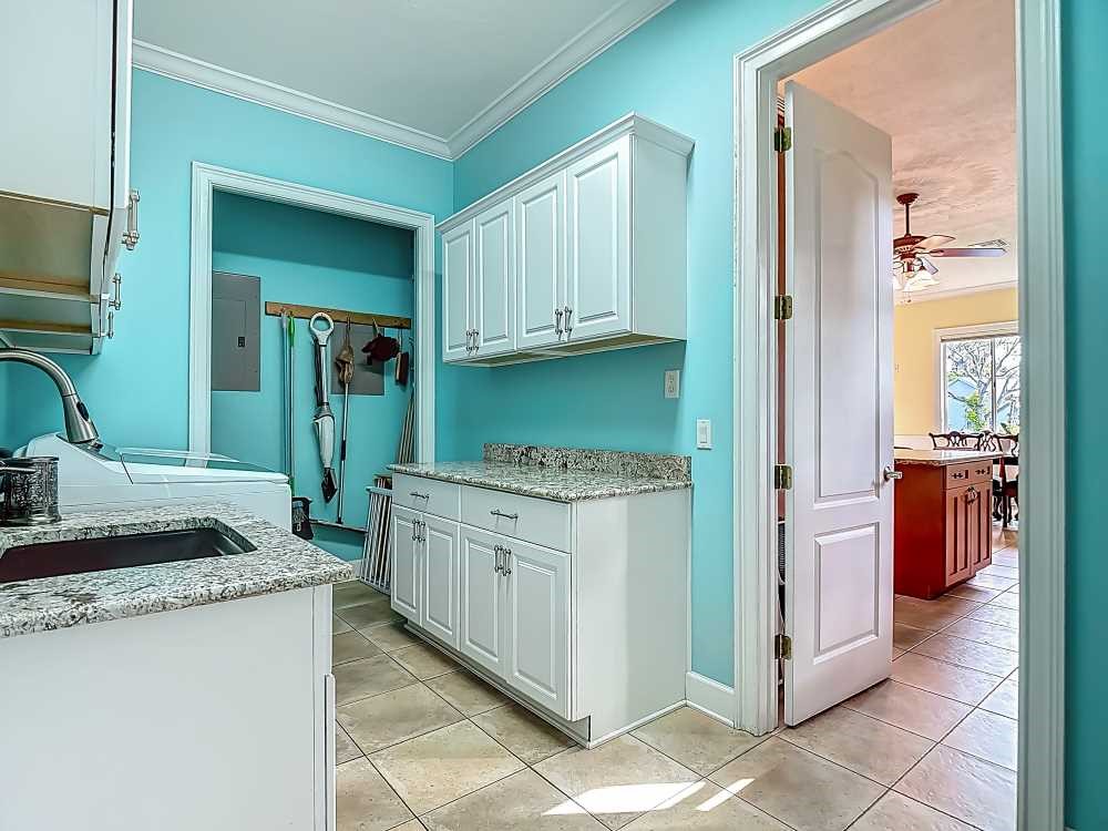 7330 36th Court Vero Beach, FL 32967 - Photo 26 of 33 a kitchen with sink and cabinets