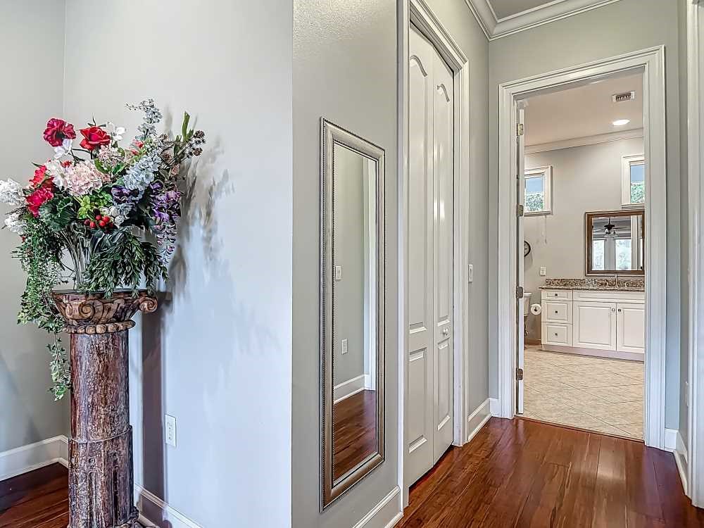 7330 36th Court Vero Beach, FL 32967 - Photo 27 of 33 a view of a hallway with wooden floor and a dining room