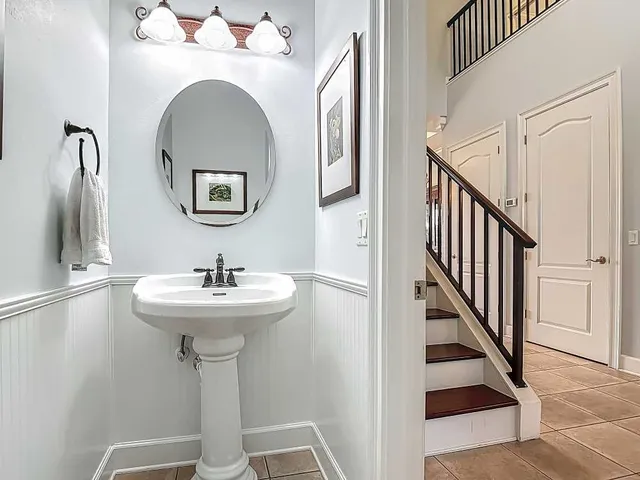 a bathroom with a sink and mirror