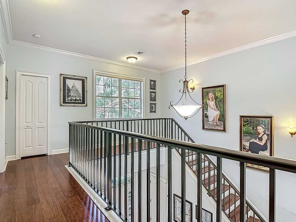 7330 36th Court Vero Beach, FL 32967 - Photo 4 of 33 a view of a hallway with wooden floor and windows