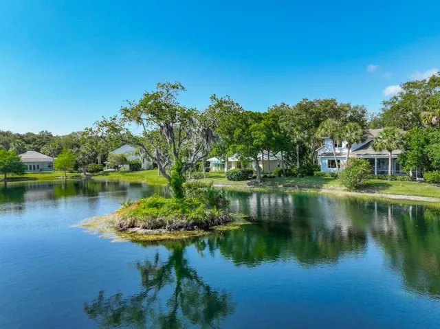 a view of a lake with a house in the background