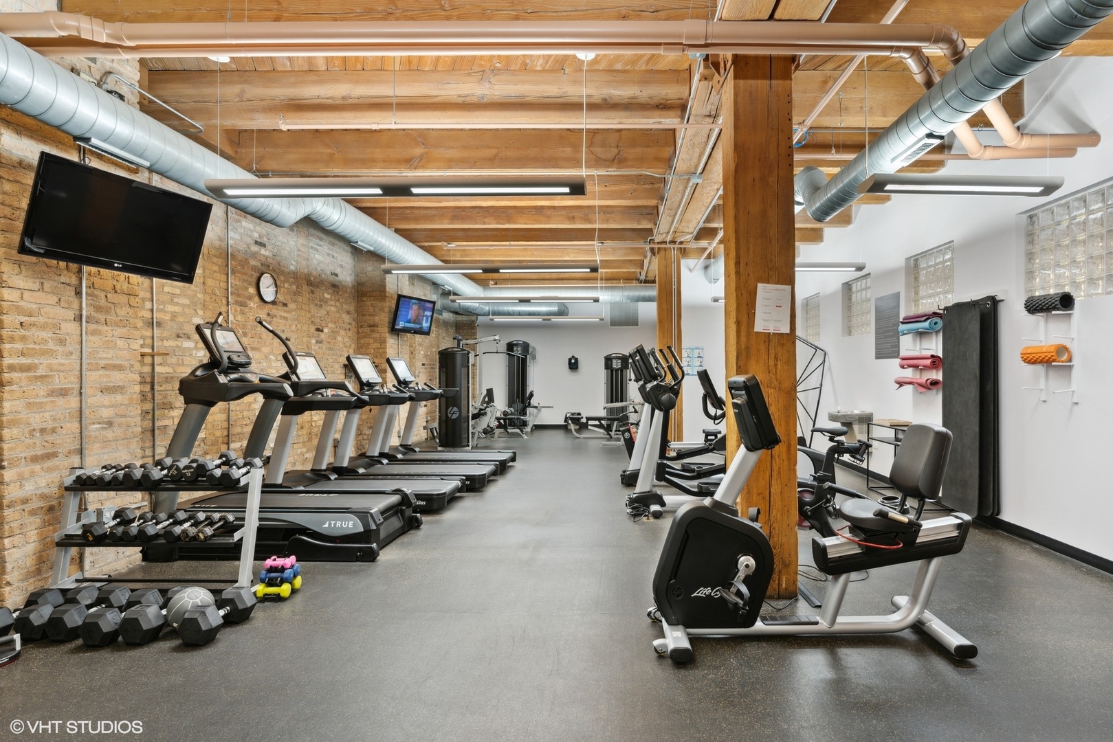 1040 West Adams Street, Unit 107 Chicago, IL 60607 - Photo 13 of 14 a view of a room with gym equipment