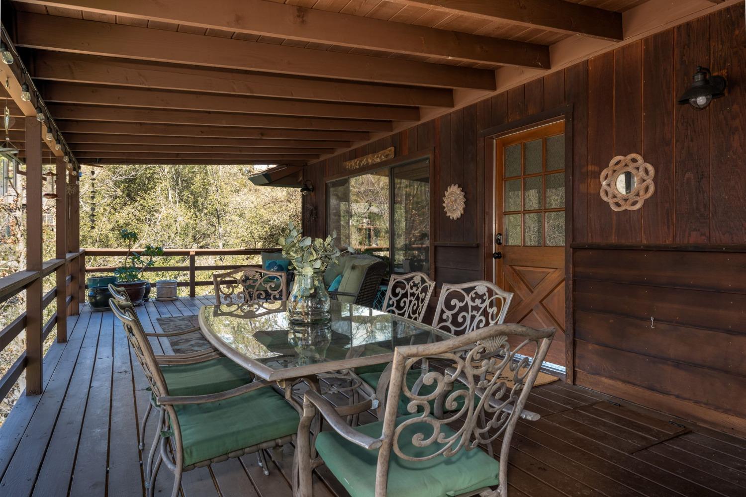 42538 Buckeye Road Oakhurst, CA 93644 - Photo 13 of 46 a view of a dining room with furniture wooden floor and chandelier