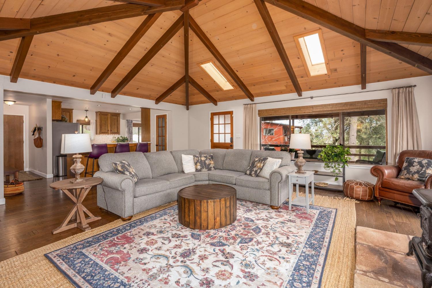 42538 Buckeye Road Oakhurst, CA 93644 - Photo 15 of 46 a living room with furniture a rug and a large window