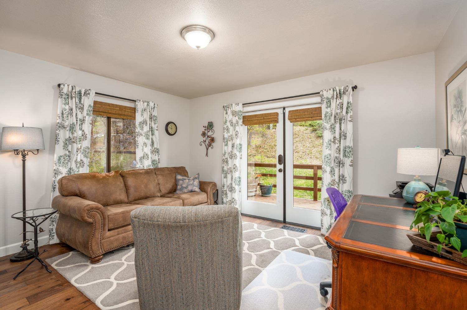 42538 Buckeye Road Oakhurst, CA 93644 - Photo 23 of 46 a living room with furniture and a window