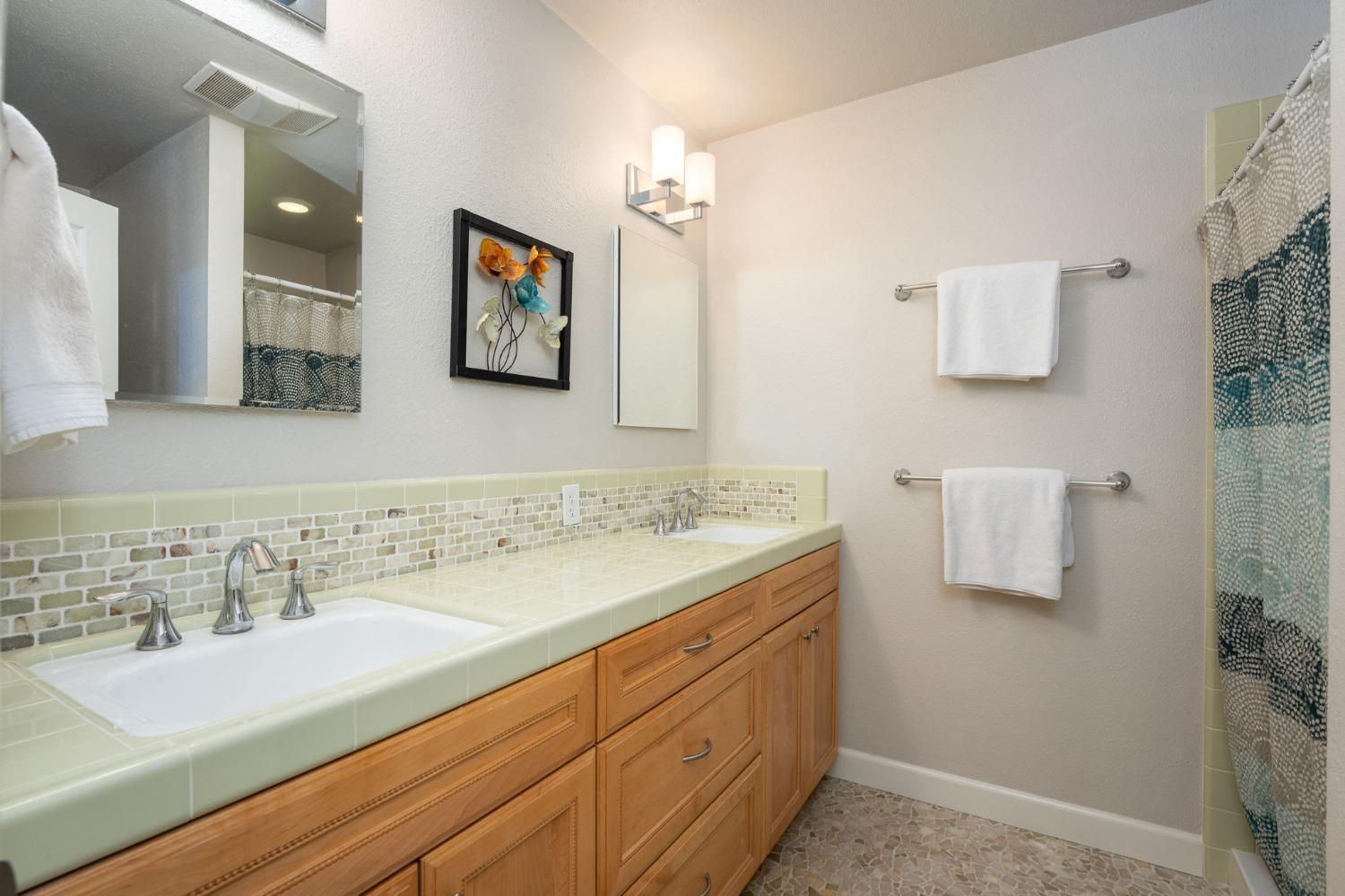 42538 Buckeye Road Oakhurst, CA 93644 - Photo 25 of 46 a bathroom with a sink and a mirror
