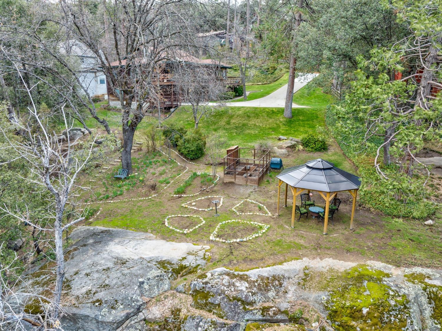 42538 Buckeye Road Oakhurst, CA 93644 - Photo 38 of 46 a view of a swimming pool with a patio