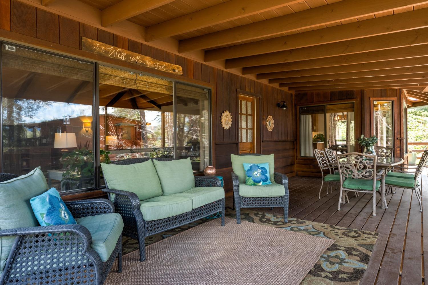 42538 Buckeye Road Oakhurst, CA 93644 - Photo 5 of 46 a outdoor living space with furniture and a black umbrella