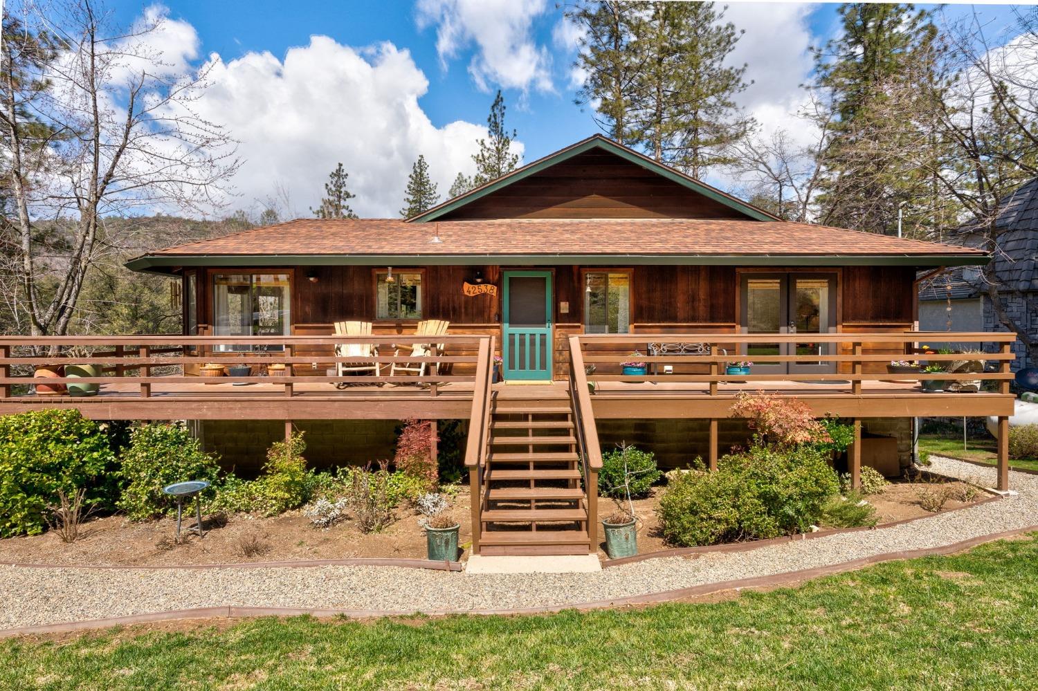 42538 Buckeye Road Oakhurst, CA 93644 - Photo 7 of 46 a front view of a house with a yard