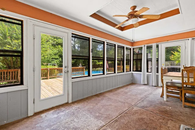 a view of an empty room with a window