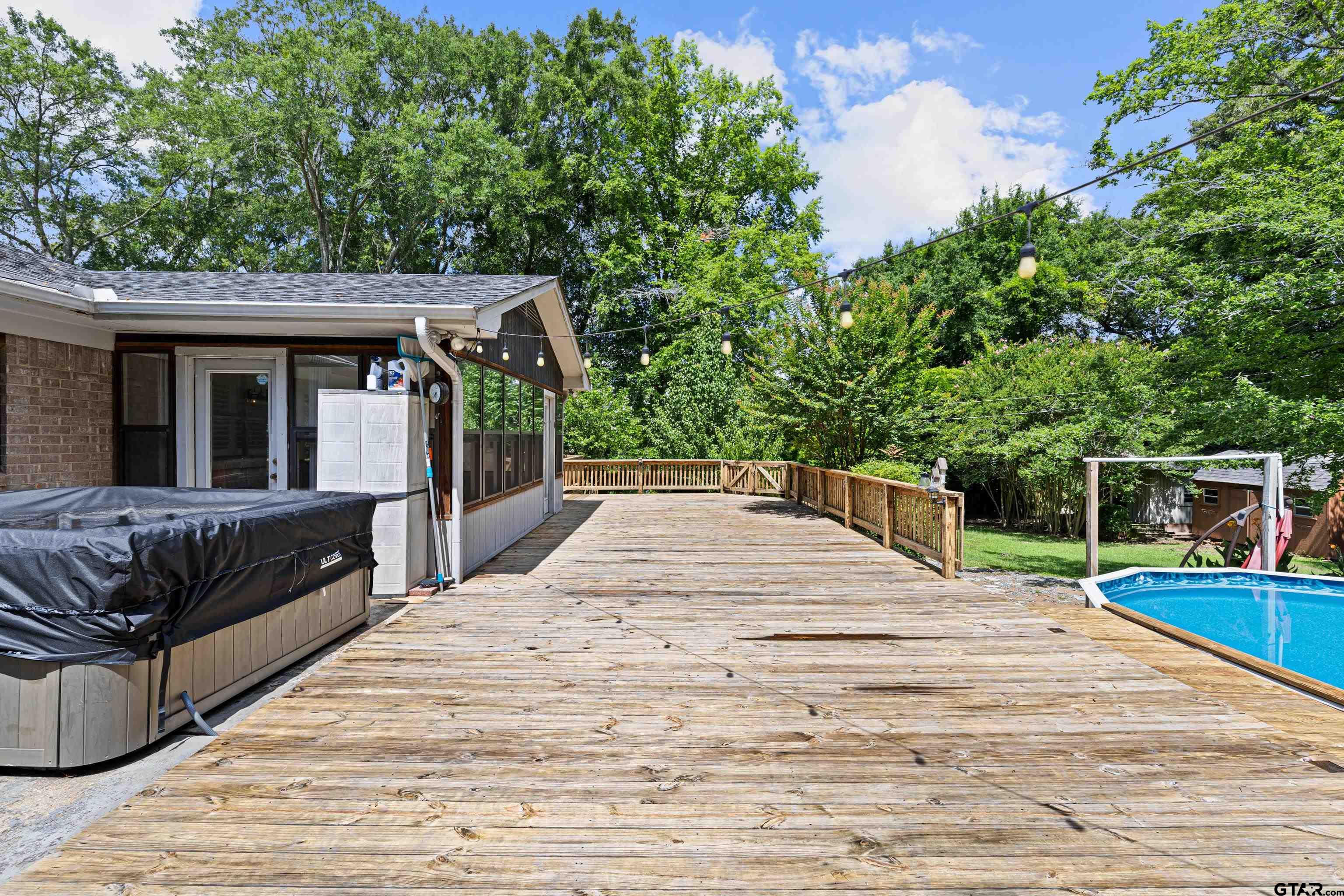 1821 Azalea Street Gilmer, TX 75644 - Photo 26 of 35 a view of a roof deck with couches and wooden floor