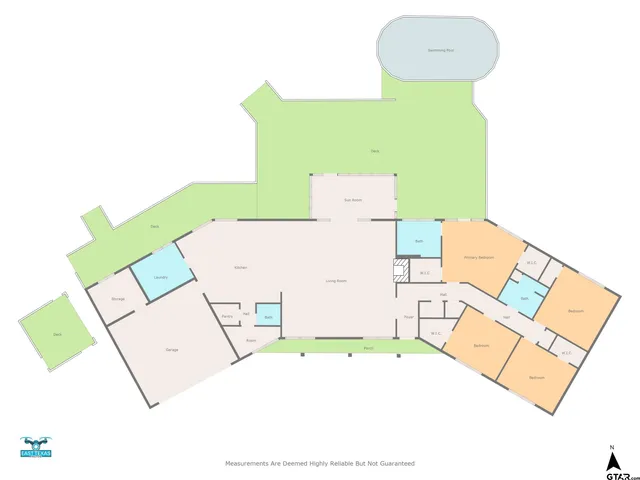 an aerial view of a house with a swimming pool and sitting area