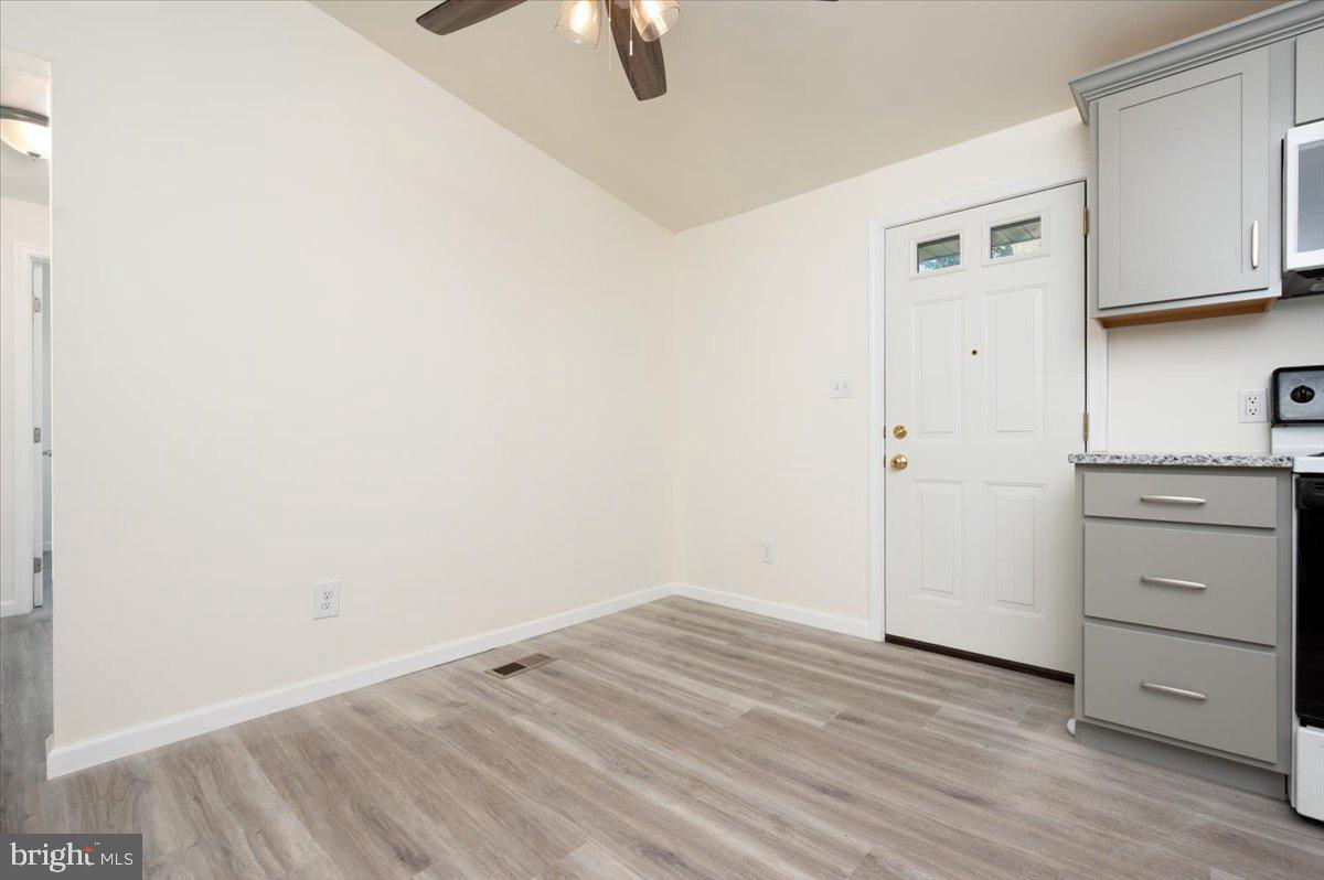 8068 Clark Station Road Severn, MD 21144 - Photo 10 of 35 Dining Area And Door To Deck And Backyard