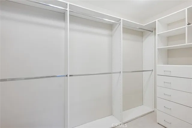 a view of an empty walk in closet