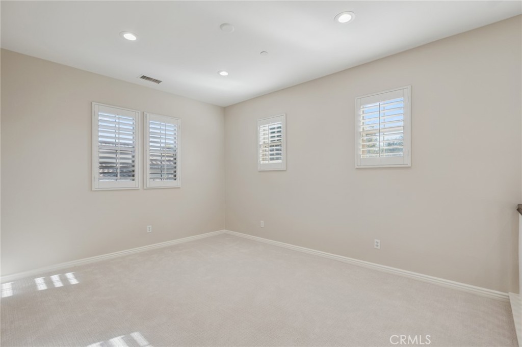22 Ridge Valley Irvine, CA 92618 - Photo 20 of 37 an empty room with windows