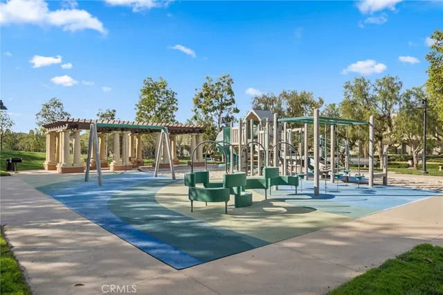 a view of a water fountain and a big yard