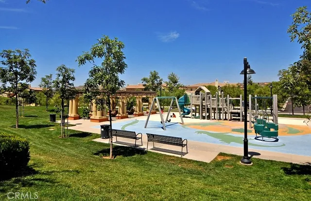 a swimming pool with outdoor seating and yard