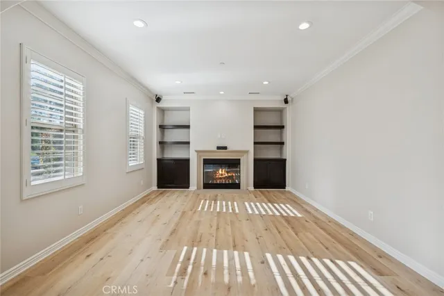 a view of a room with a fireplace and window