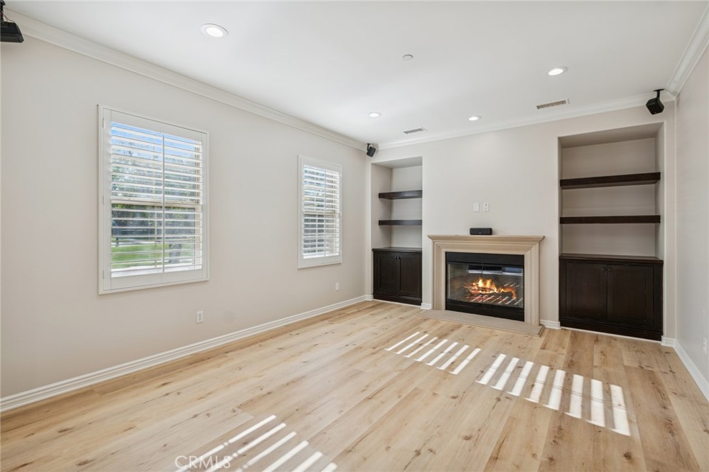 22 Ridge Valley Irvine, CA 92618 - Photo 6 of 37 a view of an empty room with a fireplace and a window