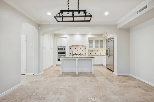 a view of a kitchen with counter top space and appliances