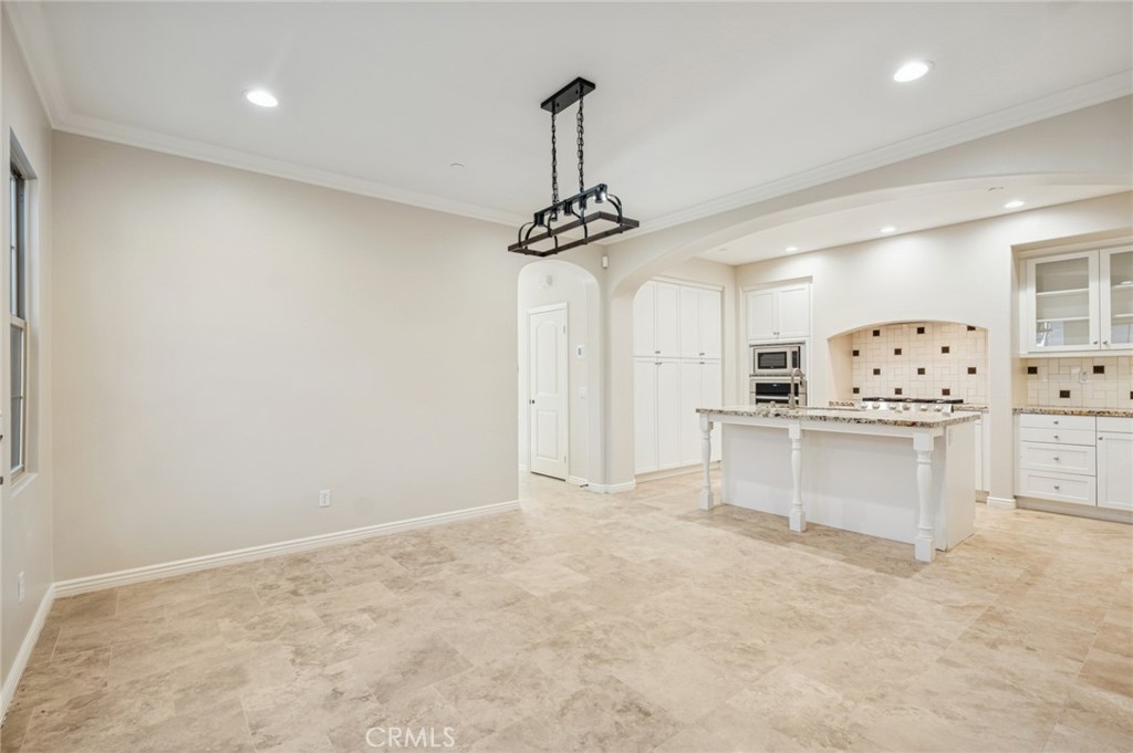 22 Ridge Valley Irvine, CA 92618 - Photo 10 of 37 a view of kitchen with refrigerator and window