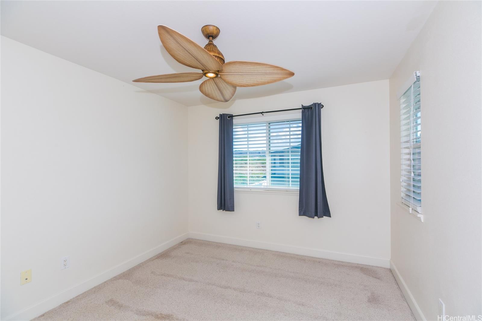 92-1516 Ali'inui Drive, Unit 1707 Kapolei, HI 96707 - Photo 11 of 23 an empty room with a window
