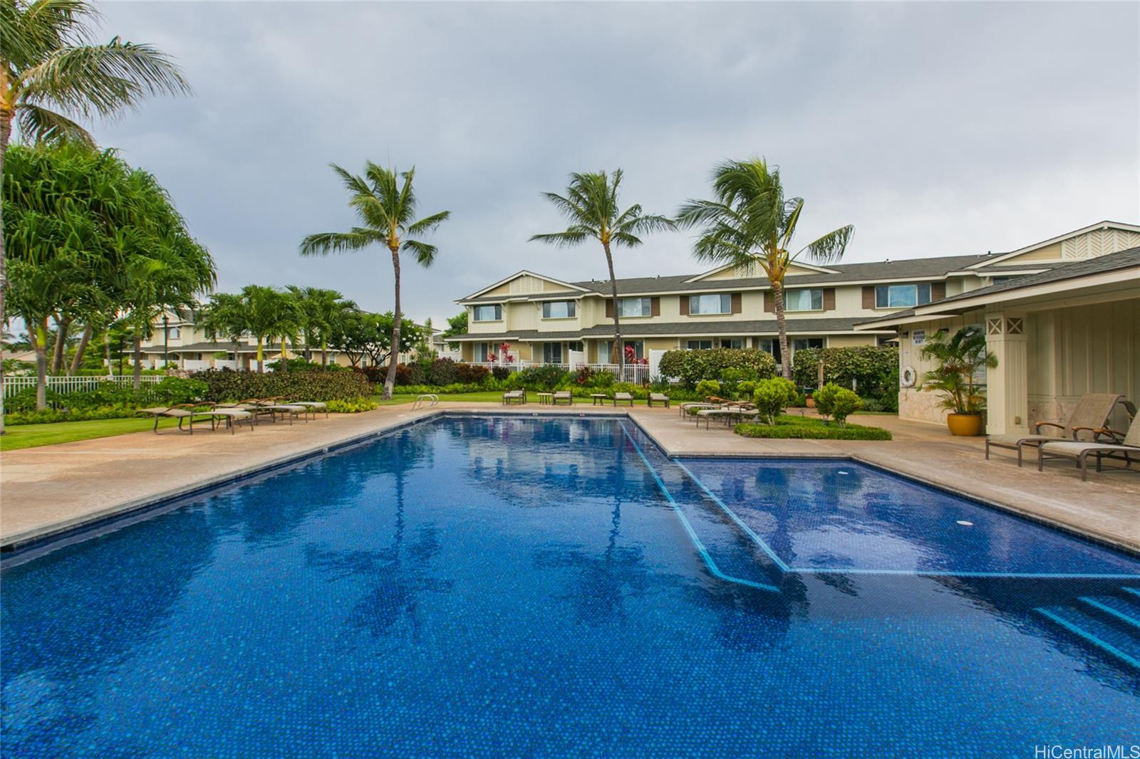 92-1516 Ali'inui Drive, Unit 1707 Kapolei, HI 96707 - Photo 17 of 23 a view of swimming pool with outdoor seating and garden
