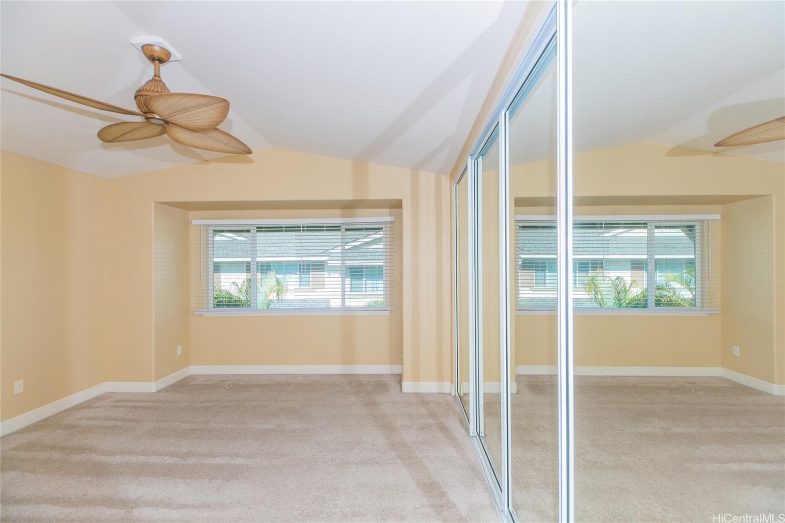 92-1516 Ali'inui Drive, Unit 1707 Kapolei, HI 96707 - Photo 5 of 23 a view of an empty room and window