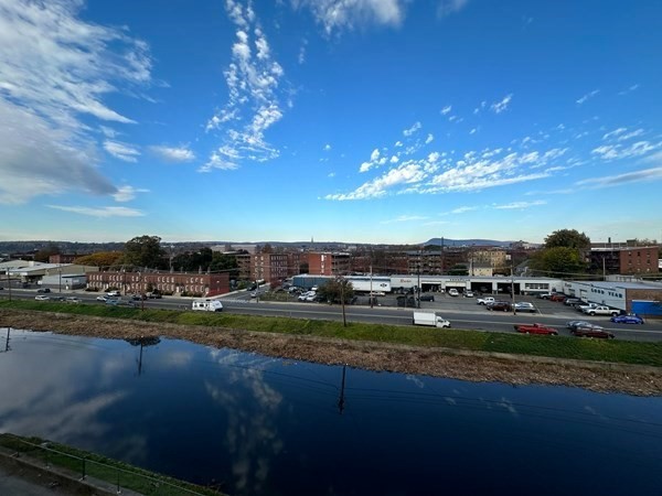 130 Middle Water Street Holyoke, MA 01040 - Photo 13 of 16 a view of a lake with houses in the background
