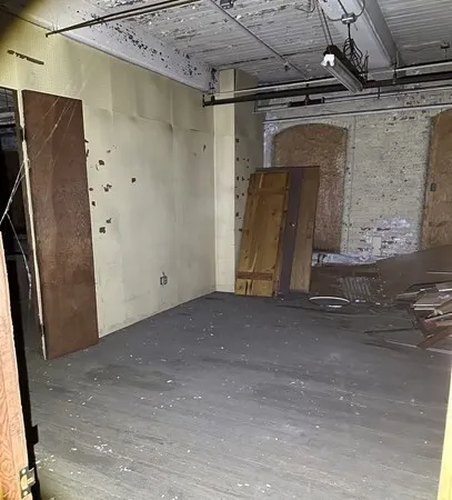 a view of garage with wooden floor