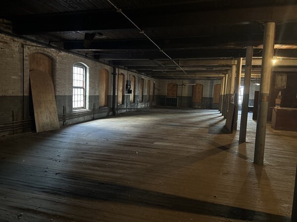 130 Middle Water Street Holyoke, MA 01040 - Photo 9 of 16 a view of an empty room with wooden floor