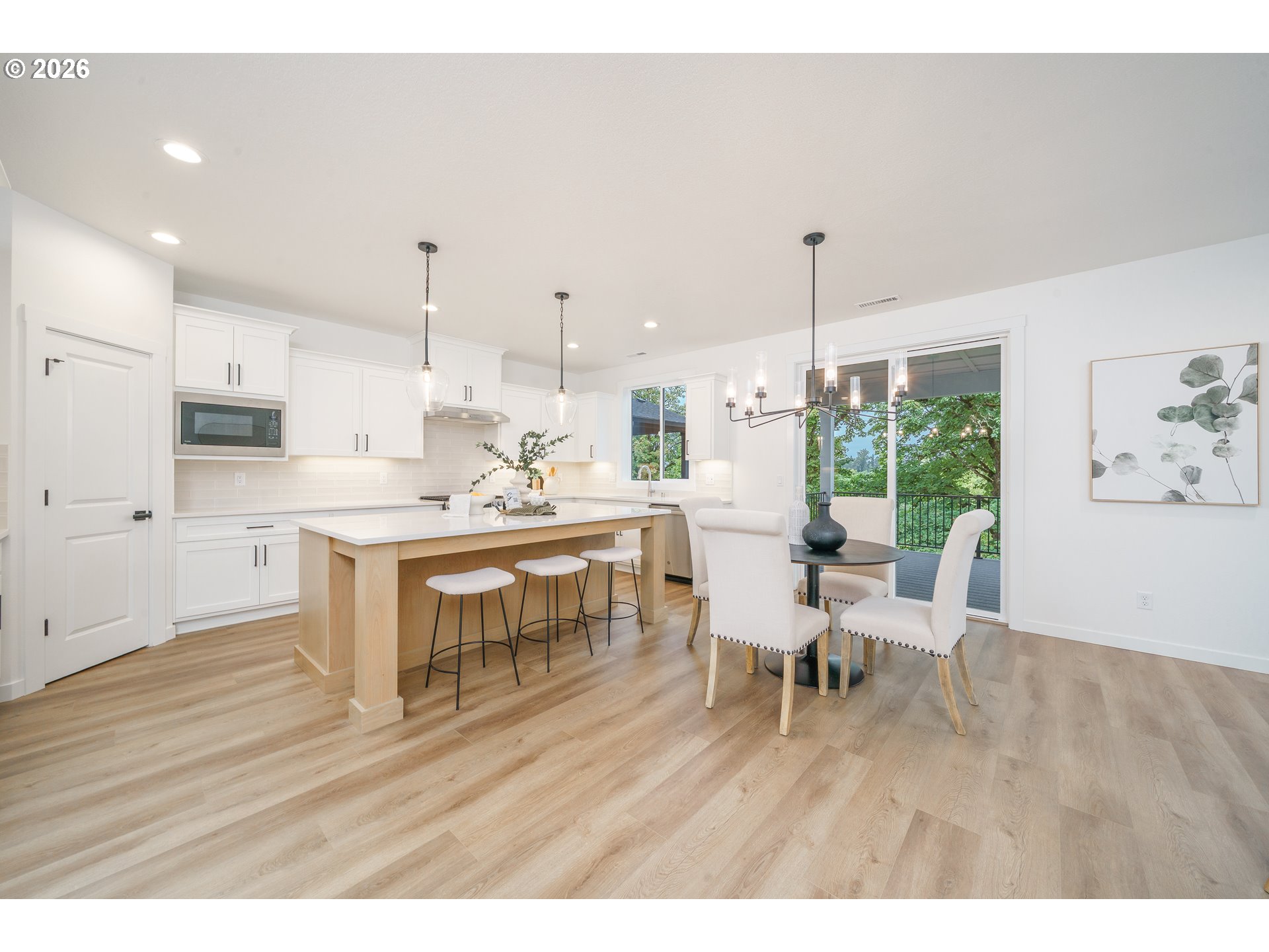 1908 Northwest 21st Circle Battle Ground, WA 98604 - Photo 11 of 40 a living room with stainless steel appliances kitchen island granite countertop furniture and a wooden floor