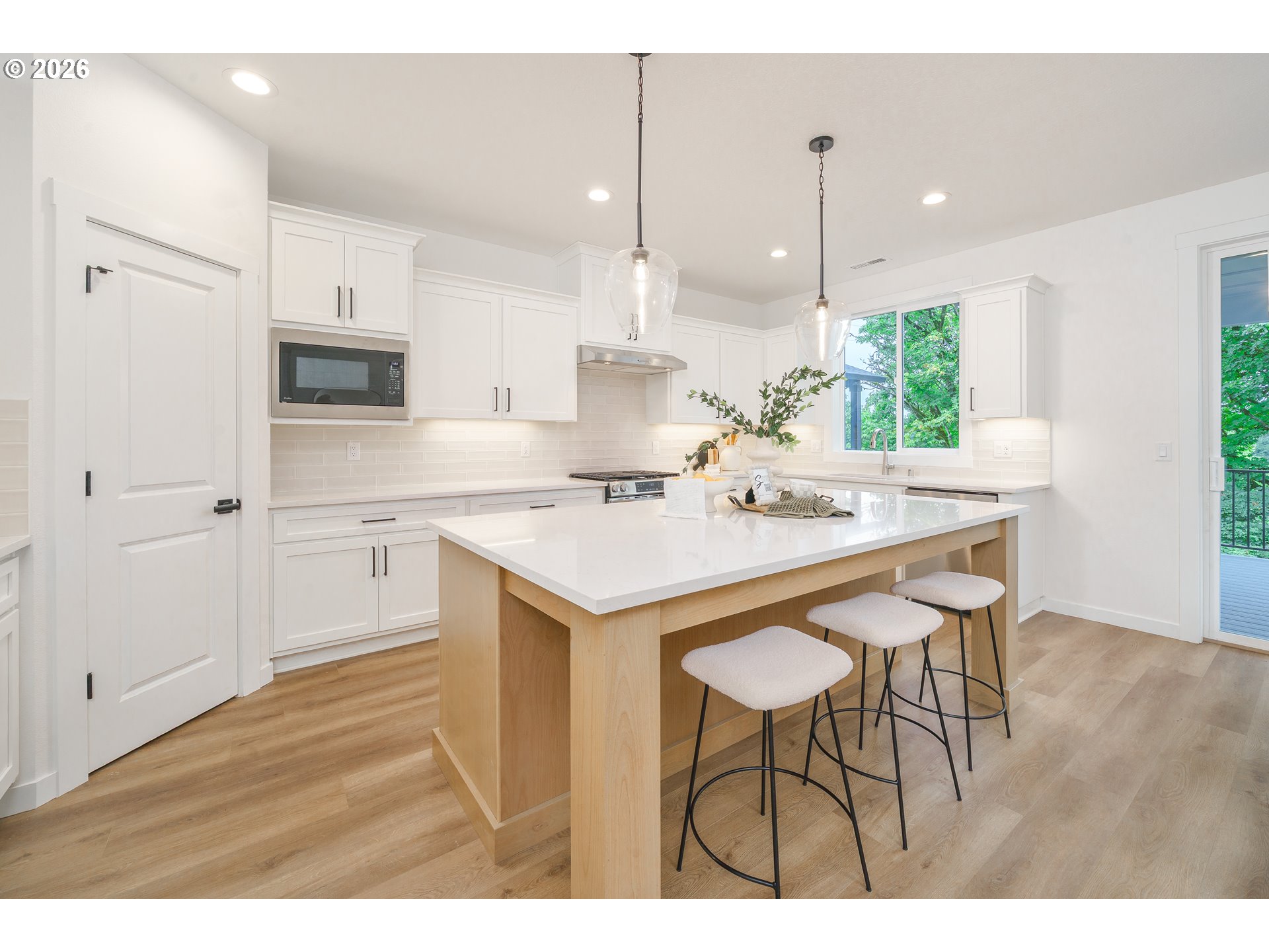 1908 Northwest 21st Circle Battle Ground, WA 98604 - Photo 18 of 40 a kitchen with a sink cabinets and wooden floor