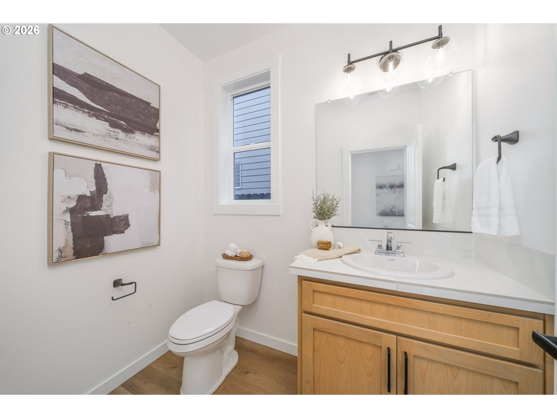 1908 Northwest 21st Circle Battle Ground, WA 98604 - Photo 19 of 40 a bathroom with a toilet a sink and mirror