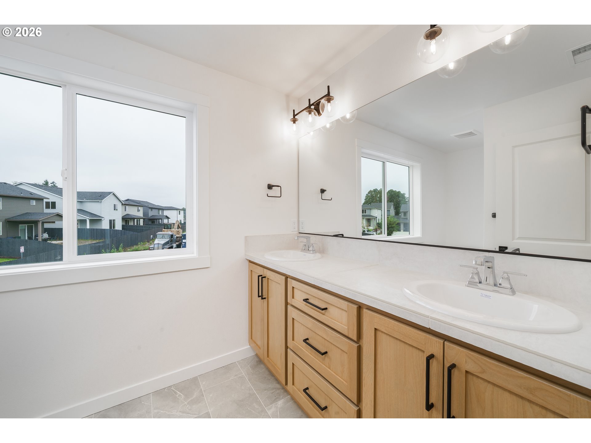 1908 Northwest 21st Circle Battle Ground, WA 98604 - Photo 22 of 40 a bathroom with a double vanity sink and a window