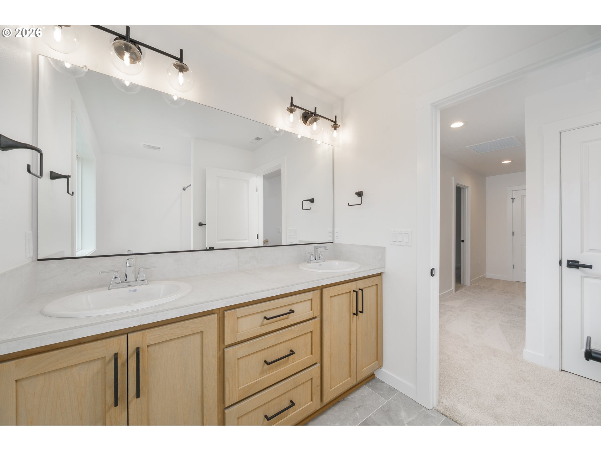 1908 Northwest 21st Circle Battle Ground, WA 98604 - Photo 23 of 40 a bathroom with a sink vanity and mirror