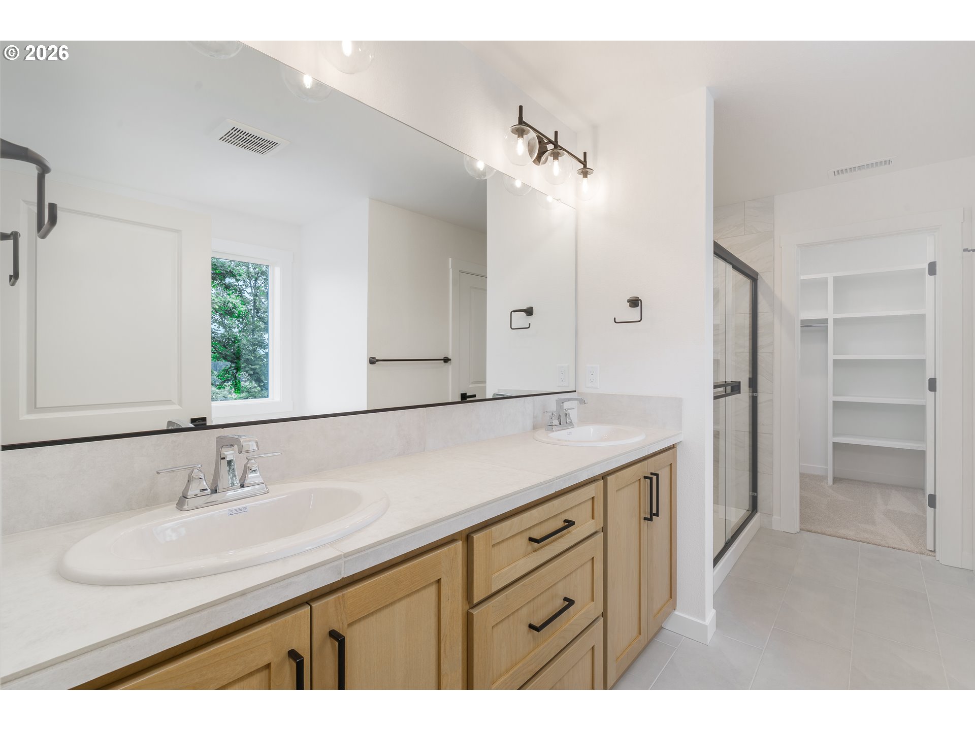 1908 Northwest 21st Circle Battle Ground, WA 98604 - Photo 32 of 40 a bathroom with a granite countertop sink mirror and a
