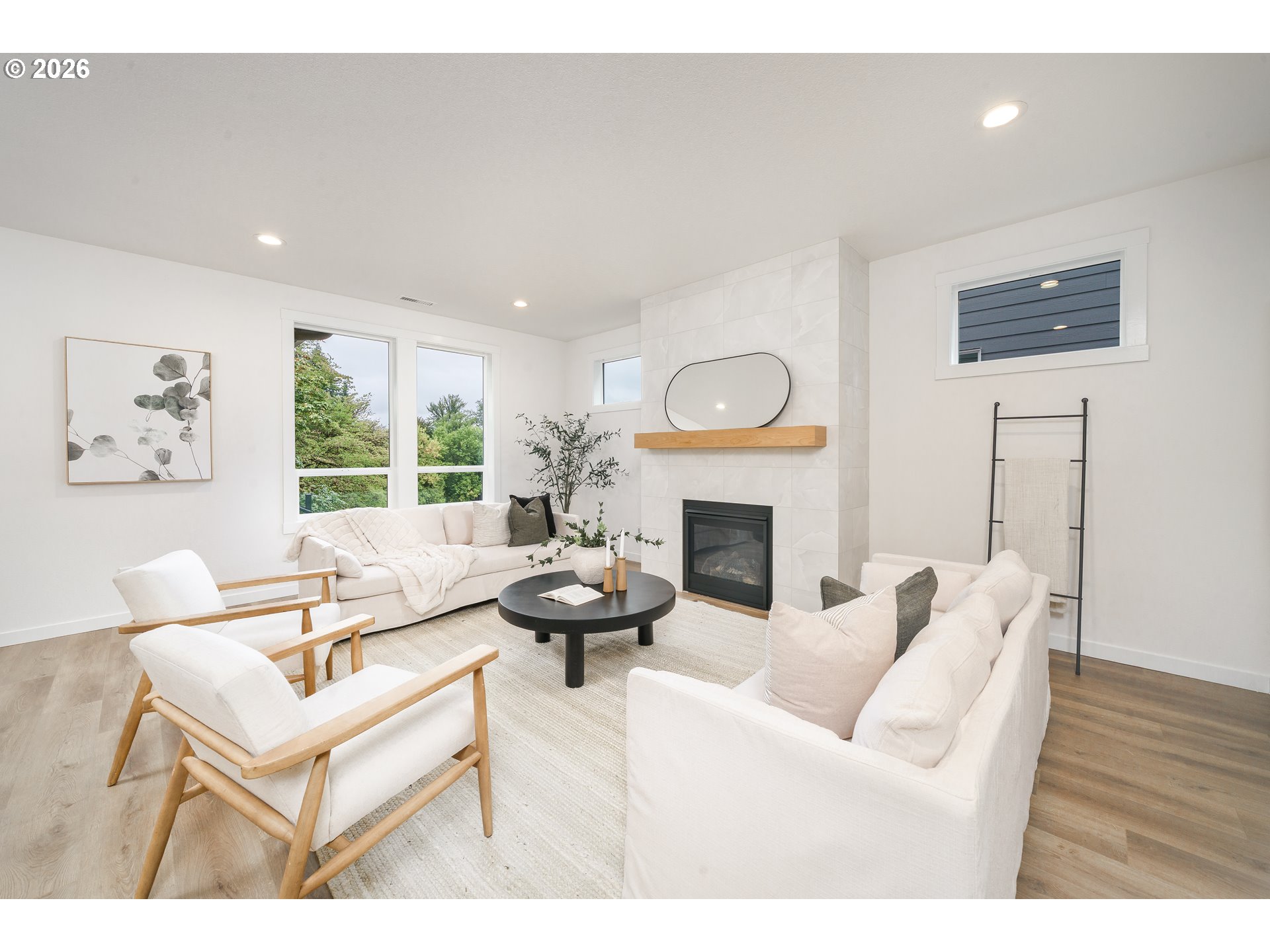 1908 Northwest 21st Circle Battle Ground, WA 98604 - Photo 35 of 40 a living room with furniture a fireplace and a large window